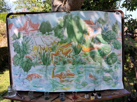 Large green and orange drawing completed during the performance