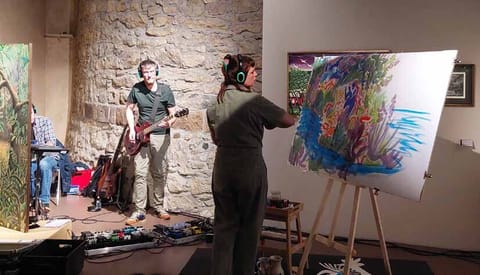 End of performance in a vaulted room: colourful ink and pastel drawing on an easel